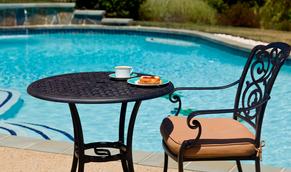 Patio Dining Set in Front of Backyard Swimming Pool