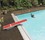 Red TrueTread Diving Board with Boy Doing a Cannonball Thumbnail for Red TrueTread Diving Board with Boy Doing a Cannonball
