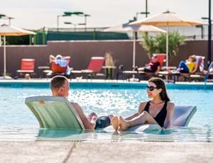 Thumbnail for Commercial Pool Loungers With Couple 